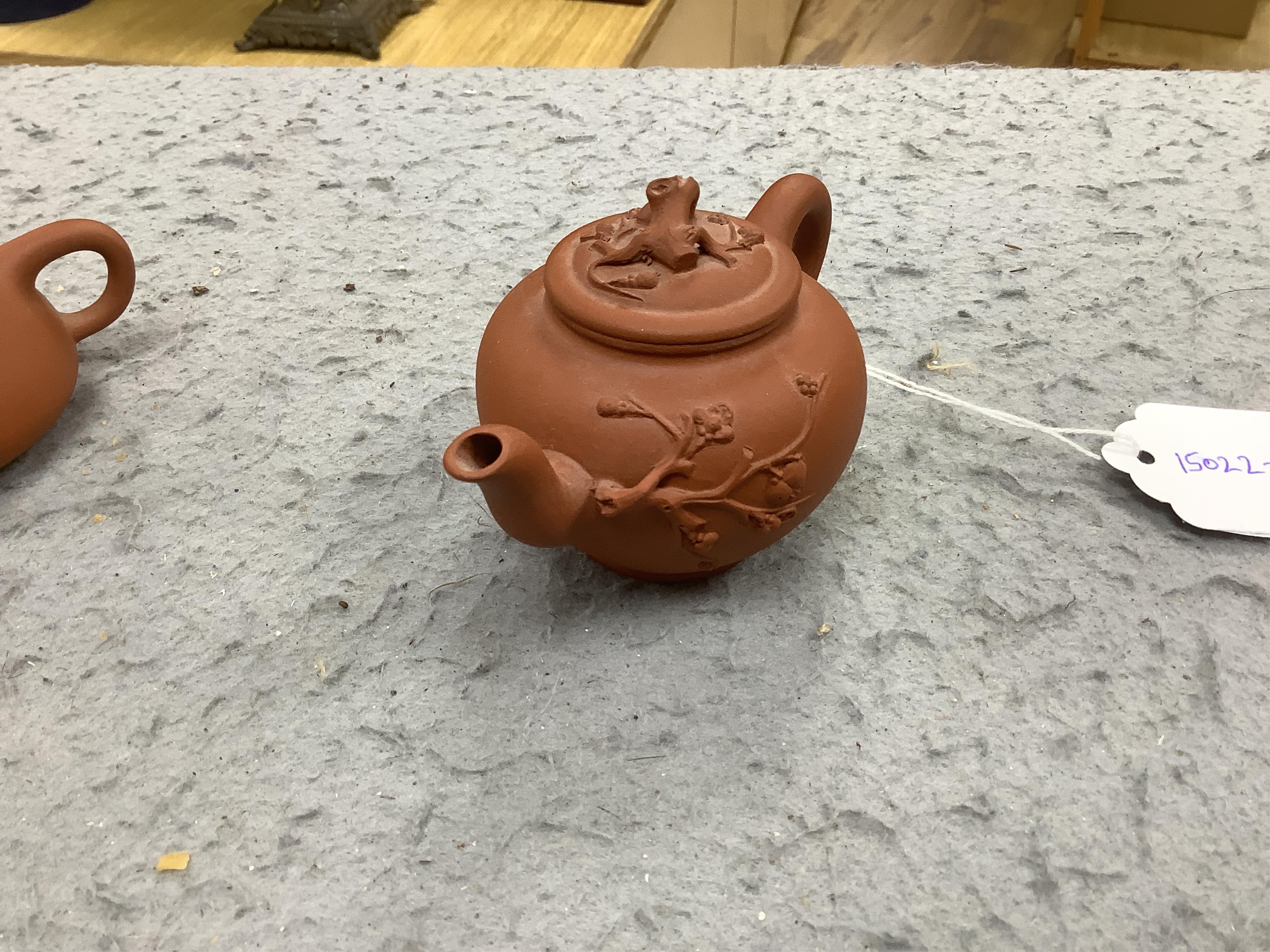 Two Chinese Yixing small teapots, largest 11.5cm wide. Condition - good